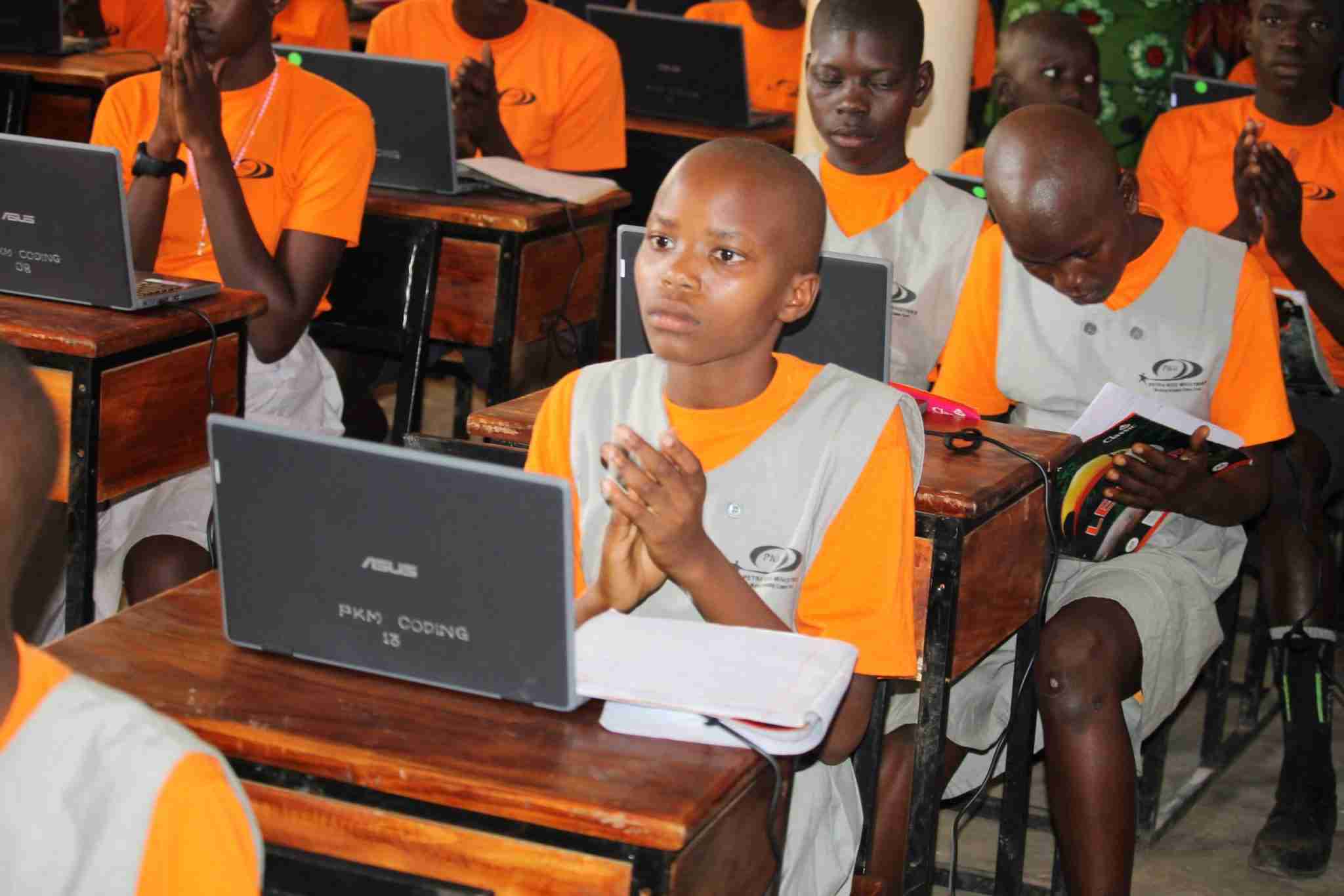 A Petra Kids student learning digital skills on a laptop